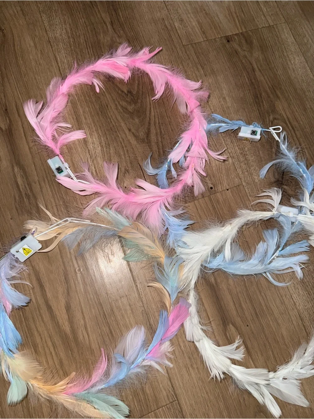 Brand new pack of 4 feather light up rave head bands